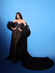 black evening gown featuring a strapless neckline 