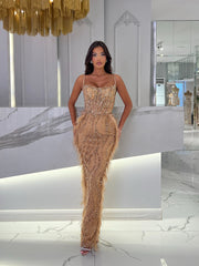golden dresses featuring rows of pearls