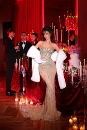 nude dress featuring a long tail and a white fur