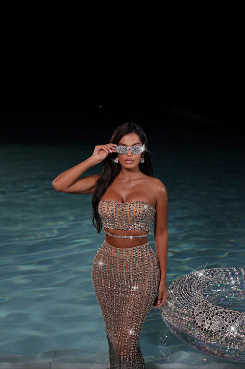 a nude two piece set covered in crystals