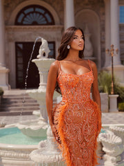 orange dress featuring feathers
