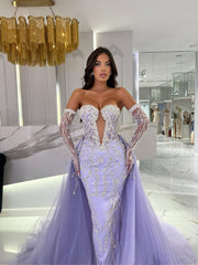 purple dress featuring opera gloves and a detachable train
