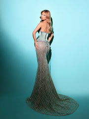 sage evening gown featuring a satin corset and a long tail