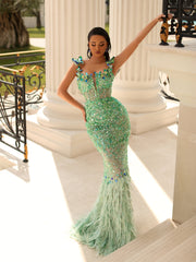 mint evening gown featuring sequins and feathers